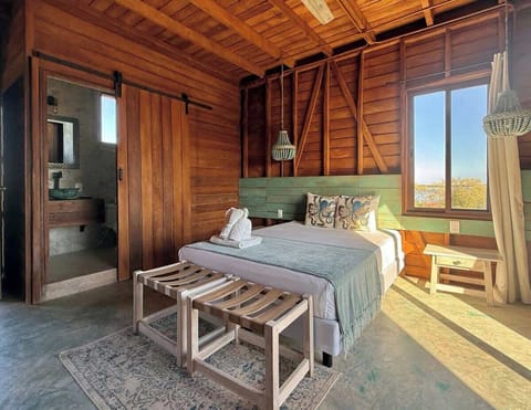 Private room with comfortable bed and wood interior