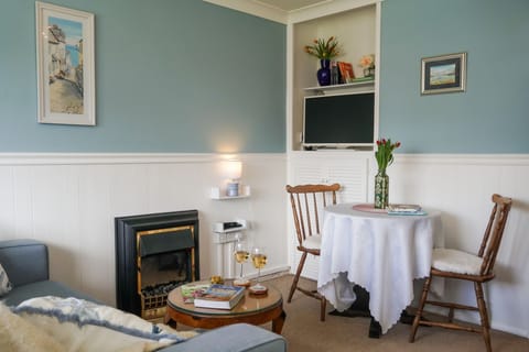 Cozy living and dining area with electric fire - Little Galmpton by Stay Ca Holidays