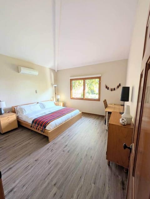 Master Bedroom: King-size bed, full bathroom, and walk-in closet.