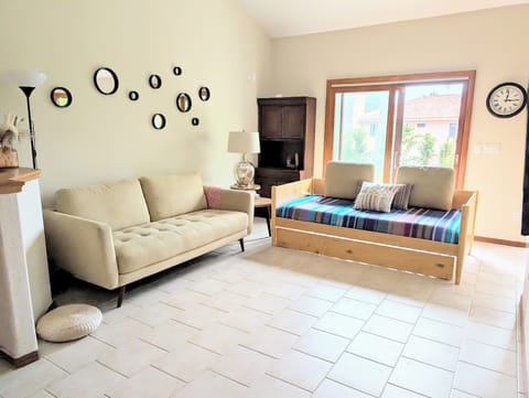 Living Room: sofa, trundle bed (8" & 10" mattresses), Smart LG TV, half bath