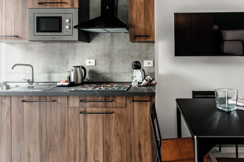 Family Quadruple Room, Balcony, City View | Private kitchen | Fridge, microwave, oven, stovetop