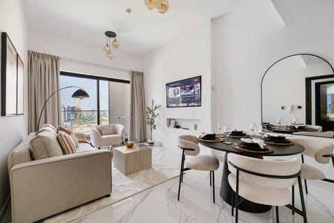 Cozy lounge with TV and elegant dining space