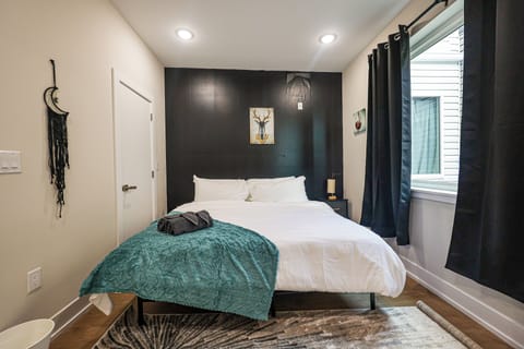 Your cozy sanctuary featuring blackout curtains and plush pillows.

