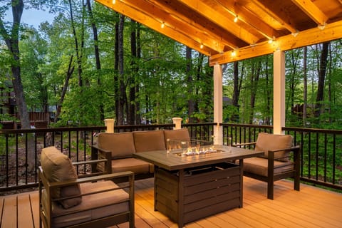 Relax outdoors with comfy seating and woodland views.