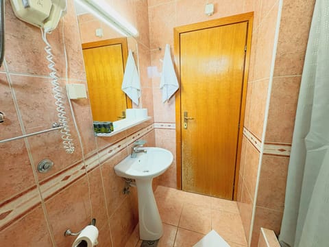 Standard Triple Room, Balcony | Bathroom | Shower, hair dryer, towels, soap