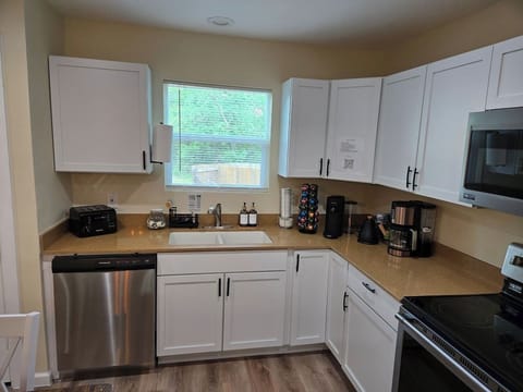 Nespresso, drip coffee maker, and kettle for your morning coffee or tea.