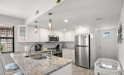 Fridge, microwave, coffee/tea maker, cookware/dishes/utensils