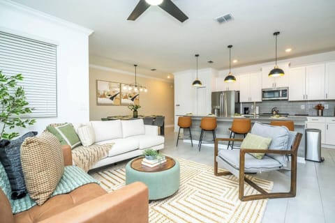 Open living space that seamlessly connects the beautiful kitchen and dining area, offering a perfect blend of comfort and style.