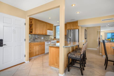 Barstools await like loyal companions, ready to host pancake feasts or storytelling over late-night cereal     WEV-2009