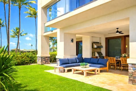 Your covered lanai opens to lush lawn and ocean views, with cushioned seating and ceiling fans for breezy mornings or sunset cocktails. MON-2204