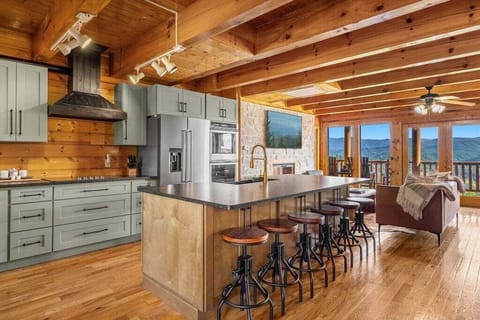 Oversized kitchen island seats six—perfect for gathering, grazing, and making memories.