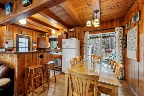 Main floor with living area, kitchen and dining table.