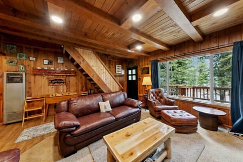 Main floor with living area, kitchen and dining table.