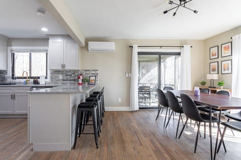Dining area opens to outdoor deck for easy entertaining.