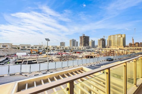 Balcony View: Embrace urban energy with stunning views of Dubai`s dynamic skyline and development!
