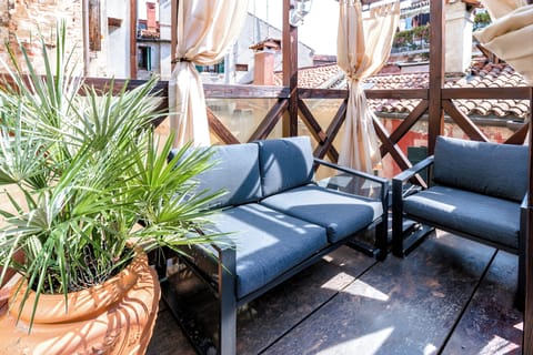 Private rooftop terrace — morning coffee / evening wine.