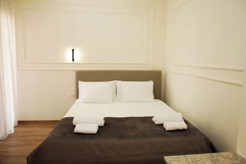 Family Quadruple Room, Balcony, City View | Iron/ironing board, free WiFi