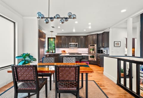 An open-concept breakfast space that blends effortlessly into the kitchen, offering a casual spot to dine, work, or chat with the chef.