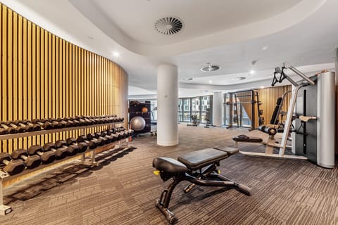 Shared Gym on level 1, seen above the pool area