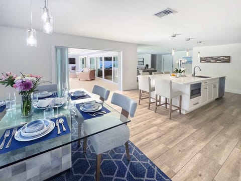 Feel the vacation vibes from the moment you step inside! Our open‐concept kitchen and living room open right onto the pool deck. Chat with friends ,takes a quick dip or unwind on the sofa . It’s all connected, just like good times should be.