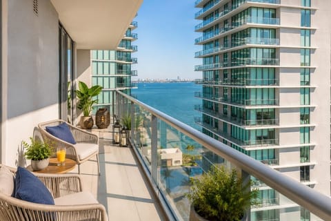 Enjoy your morning coffee or evening breeze from this private balcony with city views.