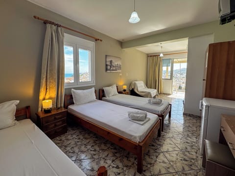 Triple Room, Balcony | Desk, laptop workspace, free WiFi, bed sheets