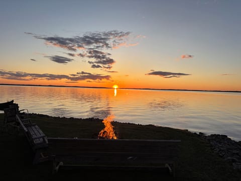 Fire pit by the lake with panoramic views.