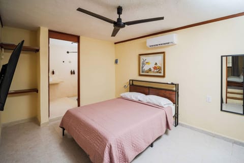 Queen Bed with Window and Blackout Curtains
Designed for deep rest — natural light and garden view by day, blackout privacy by night.