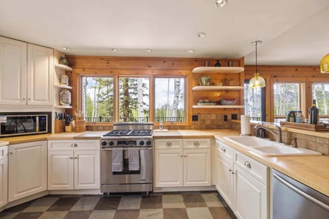 Kitchen: Main floor, Dacor oven, Jenn-Air fridge, drip coffee maker, French press, blender, toaster oven, food processor, cooking utensils, tableware