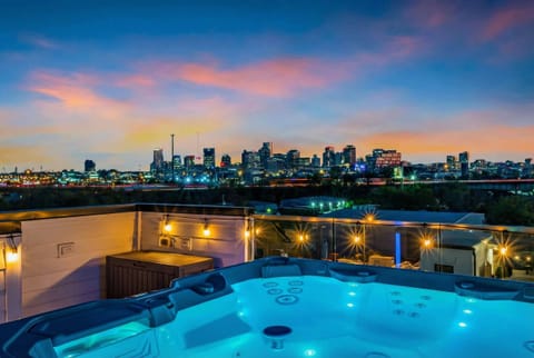 Two rooftop hot tubs means two crews, two views, and zero wait to sink in as Nashville's skyline shifts from gold to deep blue