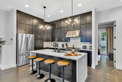 Step into this elegant kitchen, perfect for hosting stylish get-togethers or enjoying a glass of wine. Experience luxury living in the heart of Nashville for your next getaway!