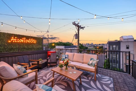 Sunset from the rooftop patio is when the real celebration begins, with string lights glowing above and the Nashville skyline as your backdrop for toasts