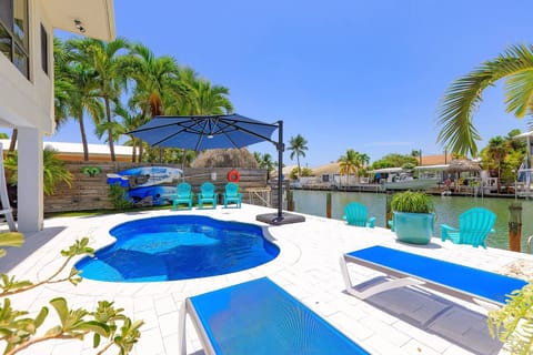 Relax by the heated/chilled pool and enjoy the perfect water temperature year-round. (Note: kayaks not available to guests)