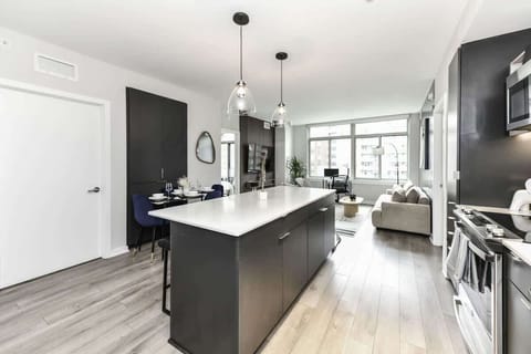 Fully equipped kitchen with a breakfast counter (seats 3) and a dining area (seats 4), plus a high chair available for little ones.