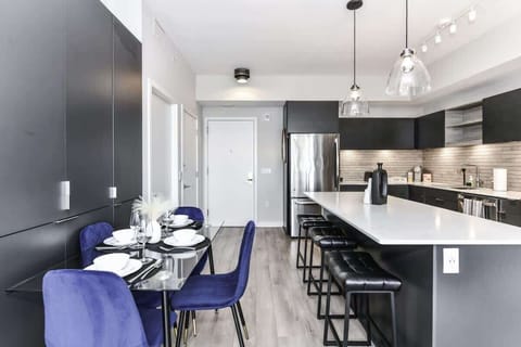 Fully equipped kitchen with a breakfast counter (seats 3) and a dining area (seats 4), plus a high chair available for little ones.