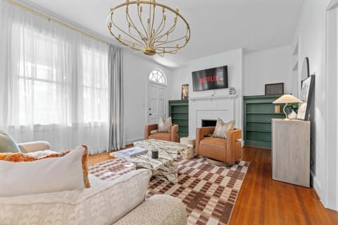 "Bright and inviting living room filled with natural light — a perfect space to relax and gather."