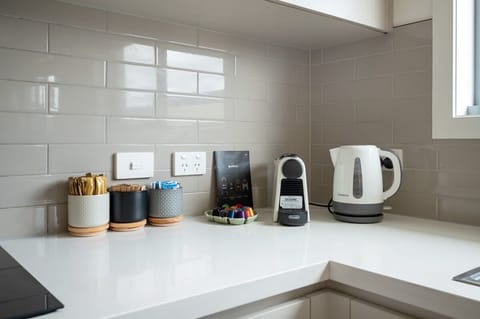 Well-appointed kitchen with Nespresso coffee machine.