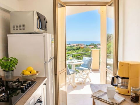 Apartment, Furniture, Home, Chair, Kitchen & Dining Room Table, Wood Stain, Balcony, Major Appliance, Kitchen Appliance, Resort