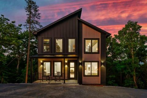 Stunning modern design with inviting seating and breathtaking forest views!