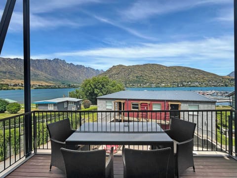 Balcony outlook across lake and mountain ranges