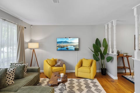 Plush couches with TV and standing lamp