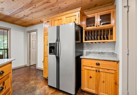 Stainless steel appliances and natural wood cabinets make this kitchen as functional as it is beautiful.