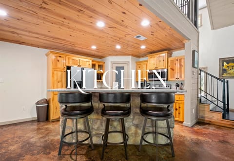 Rustic touches meet modern convenience. This spacious kitchen is ready for pancake breakfasts and evening wine chats.