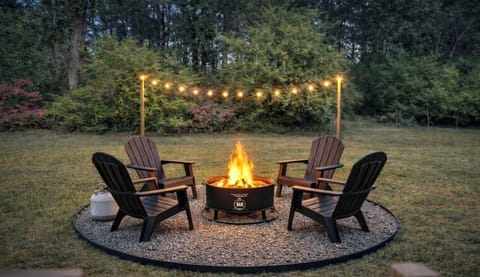 Propane fire pit in private backyard.