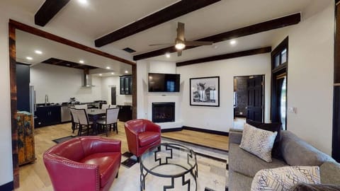 Open living room with full seating and gas fire place