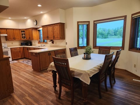 Kitchen opens to dining
Dining Table has 2 leaves, increasing seating to 10