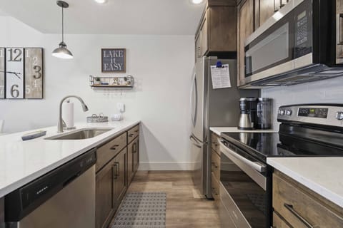 Fully-equipped modern kitchen with stainless steel appliances and all the small gadgets you'd need to make a tasty meal!