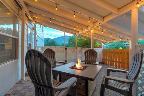 Welcome to Vermijo Nook! Your cozy hideaway with a private patio, glowing fire table, and string lights framed by mountain views.