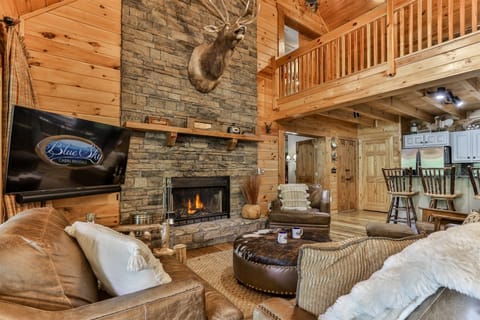 The Grand Living Room With Real Stone Gas Fireplace