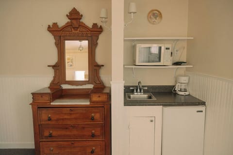 Premium Room, 1 King Bed, Jetted Tub | Private kitchen | Shared fridge, microwave